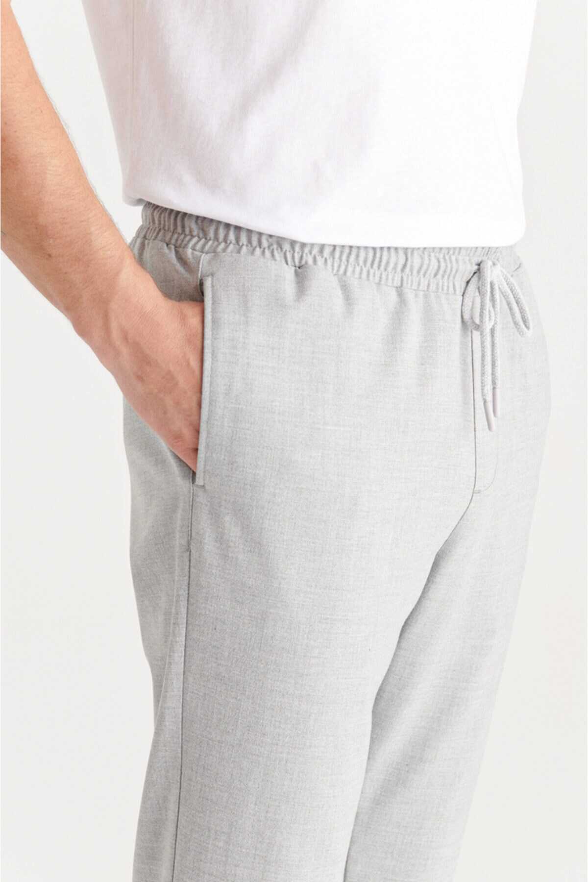 شلوار راحتی مردانه کمر کش جیب دار پاکتی خاکستری روشن برند Avva