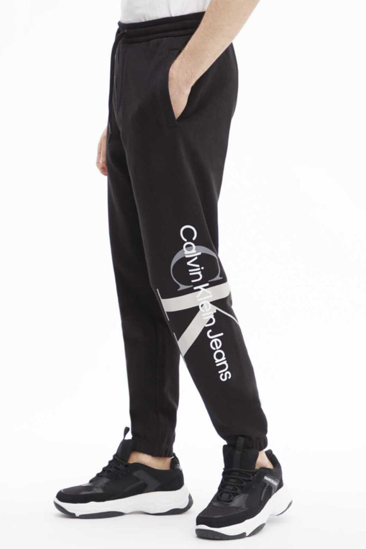شلوار ورزشی بند دار چاپ دار مردانه مشکی برند Calvin Klein