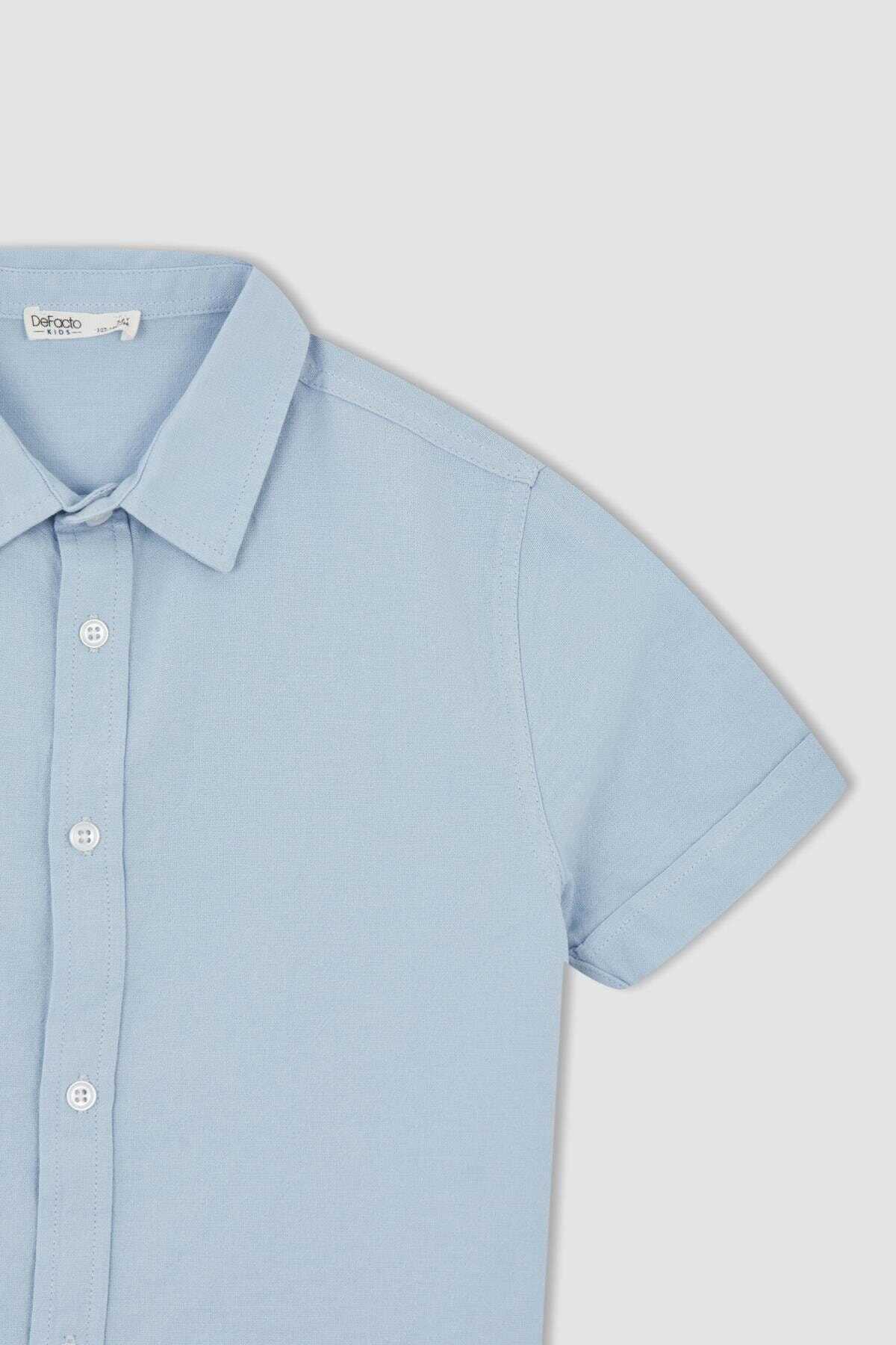 پیراهن بچه گانه پسرانه آستین کوتاه دکمه ای آبی برند DeFacto